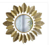 Gold-plated stainless steel leaf design mirror with an 18-inch diameter.