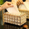 Elegant crystal tissue box with metal accents, adding a touch of luxury and sophistication to any room's decor.